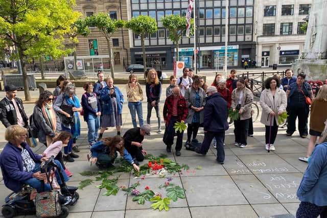 Women's rights groups in Leeds came together in Victoria Gardens to show solidarity with women across the pond
