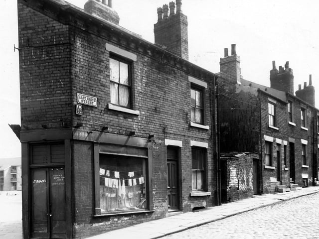 A shop is on the corner with East Grove Street in May 1960. To the left is Accommodation Road, a block of new Council maisonettes can be seen. This building work was carried out at the same time as the demolition of the old street.