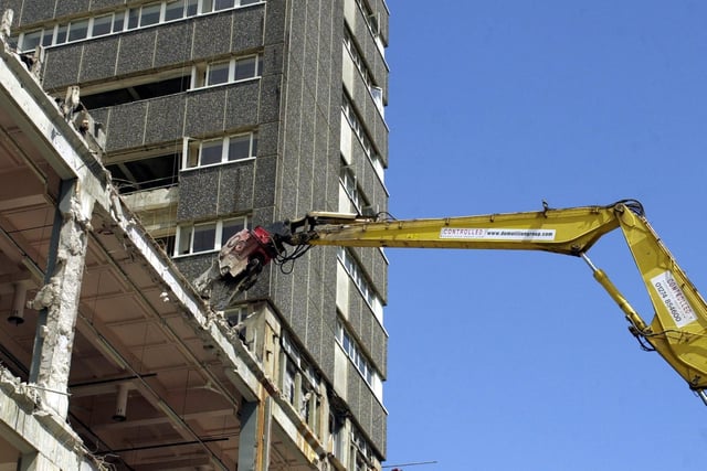 A mechanical claw reaches up the side of the old Royal Mail building on Whitehall road during the demolition.
