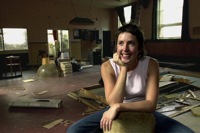 This is Pippa Hale, artist in residence at East St Arts. She is pictured in the old snooker hall of the St Patrick's Social Club where she was working on an exhibition.