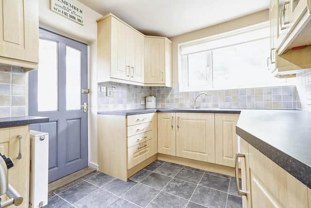 Internally the property benefits from versatile living space, a sleek kitchen and large bedrooms.