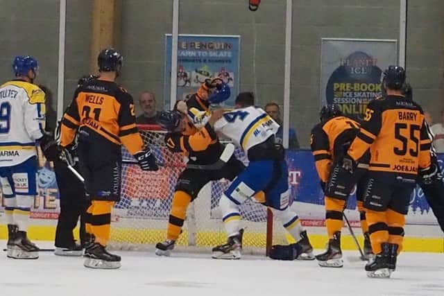 MIXING IT UP: Jordan Griffin (#44) drops the gloves during a home game against Raiders last season. Picture supplied by Leeds Knights IHC.