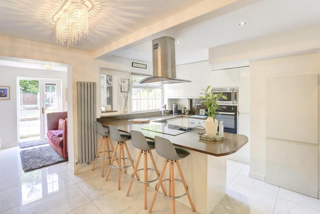 Other kitchen features include an integrated electric hob with extractor fan, a dishwasher and space for a free standing fridge and freezer. The space benefits from tiled flooring, spotlights and a breakfast bar with space for seating.