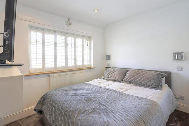 At first floor level there are three good sized bedrooms, two with fitted wardrobes.