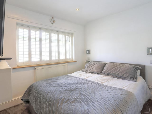 At first floor level there are three good sized bedrooms, two with fitted wardrobes.