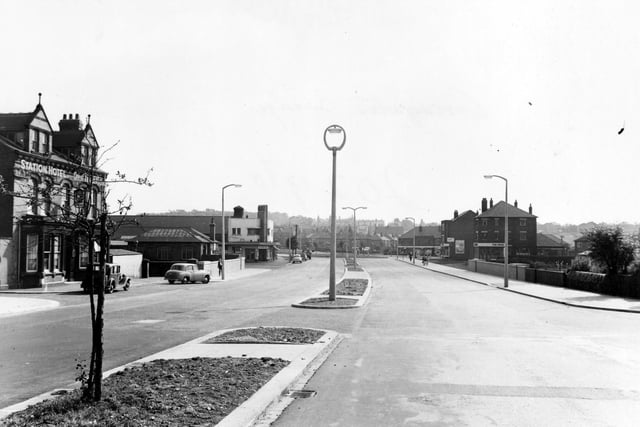 The completed Cross Gates Bridge on Station Road in September 1955. New central reservation with electric street light fittings. Hotel, Tetley's pub, Cross Gates Station and Ritz cinema on left.