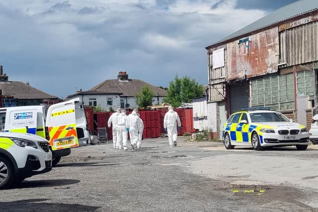 Police set up a cordon around a car park of an industrial unit on Thornbury Road, Bradford, on Wednesday, with forensic officers combing the site. Picture: SWNS