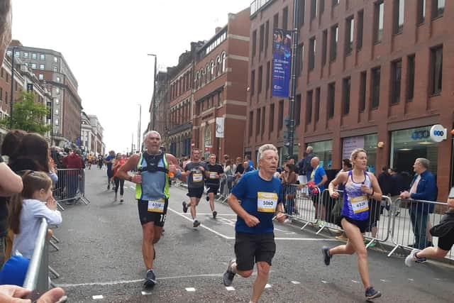 Runners approach the finish line on The Headrow. PIC: Andrew Hutchinson