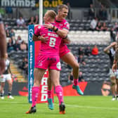 Ash Handley celebrates with Mikolaj Oledzki after scoring his fifth try against Hull FC. Picture: Bruce Rollinson.