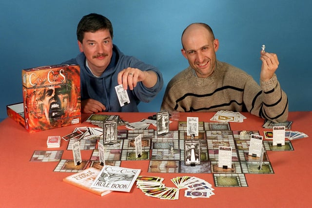 Entrepreneurs Martyn Oliver  packed in their jobs to start a board game company. They are pictured with their board game City of Chaos.