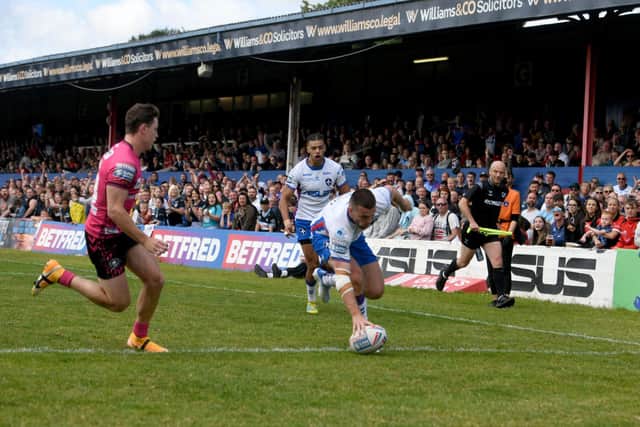 Max Jowitt touches down in front of Belle Vue's main stand which is now set for demolition. Picture by James Hardisty.