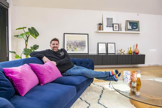Mike putting his feet up after months of hard work transforming the bungalow in a des res.