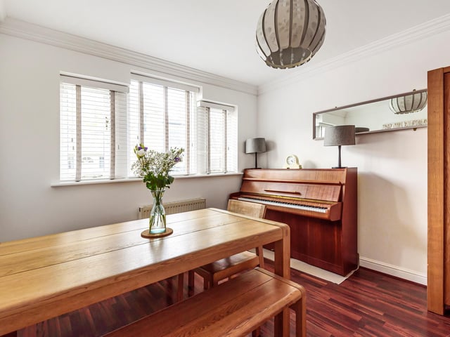 On the ground floor is a light and airy entrance hall leading to the dining room.