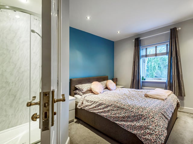 Returning to the hall, a staircase to the first floor landing leads to the master bedroom with an en-suite.