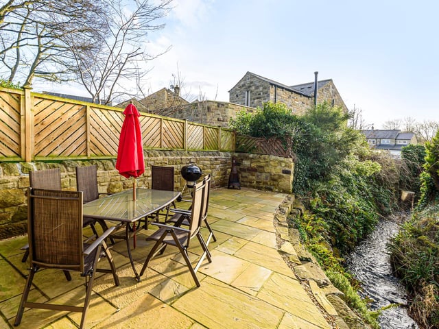 The real show stopper of this property is the wonderful outdoor space, with the stunning landscaped garden featuring a private bridge which goes over the village stream.