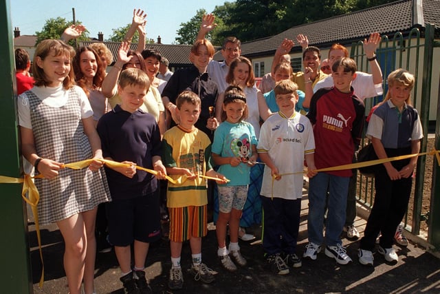 It was all cheers as the tape was cut by children to re-open the newly refurbished Stanhope Drive Youth Centre in Horsforth. Pictured, from left, are Zoe Kirk, Jason Kirk, Matthew Lewis, Danielle Rigby, Thomas Rigby, Anthony Lewis and David Walls.