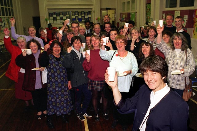 Head teacher Rita Samuel (front) celebrates with staff, parents and other supporter's during a party of thanks after the school was saved from closure.