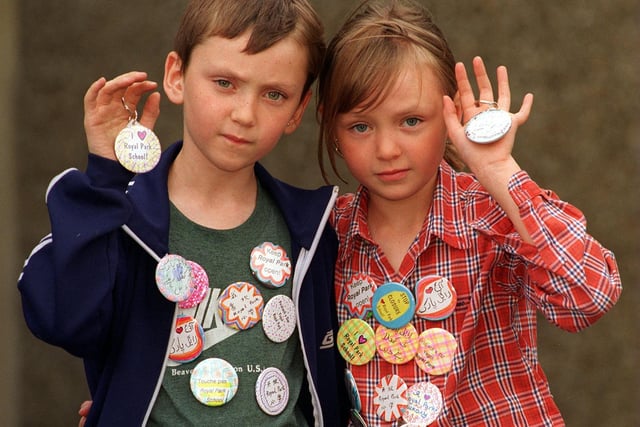 Pupils Morgan Jaquiss (left) and Georgia Witt with badges from pupils saying what was special about Royal Park Primary in September 1997.