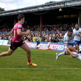 Last stand: Wakefield Trinity's Max Jowitt scores a try in front of the East Stand at Belle Vue - the final match before demolition of the structure began. Picture James Hardisty