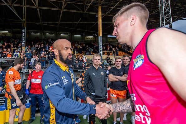 Alex Mellor, right, shakes hands with then Rhinos interim-coach Jamie Jones-Buchanan after Leeds' loss to Tigers at the Jungle in April. Picture by Allan McKenzie/SWpix.com.