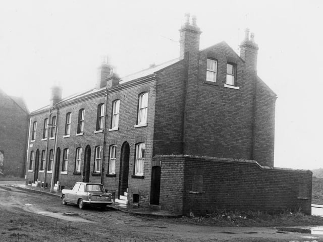 A block of four back-to-back properties on Primrose Place pictured in February 1972. On the end of the row are outside toilets. On the right edge, Burton Row is just visible.