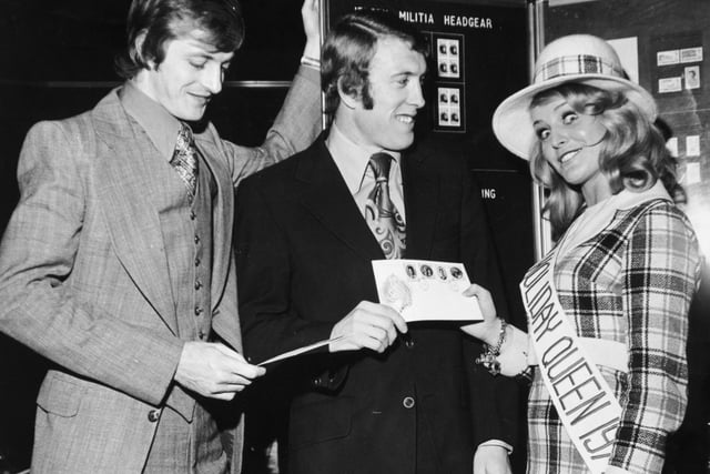Leeds Uniteds stars Allan Clarke (left) and Mick Jones are pictured with Jersey Holiday Queen Gaynor Lacey at a Holiday Exhibition held at your YEP's Wellingston Street headquarters in November 1972.
