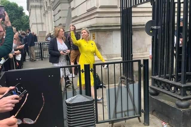 Andrea Jenkyns, Conservative MP for Morley and Outwood, making an obscene gesture to crowds outside Downing Street (Photo: Alex Clewlow)