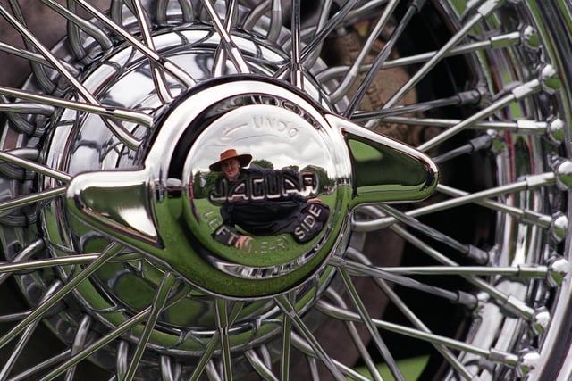 More than 1,000 cars took part in the Jaguar Car Rally at Harewood House. Pictured is Nicola Dyson reflected in the silver wheel hub of this Jaguar MK2.