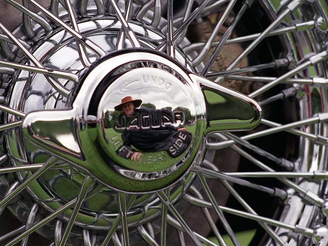 More than 1,000 cars took part in the Jaguar Car Rally at Harewood House. Pictured is Nicola Dyson reflected in the silver wheel hub of this Jaguar MK2.