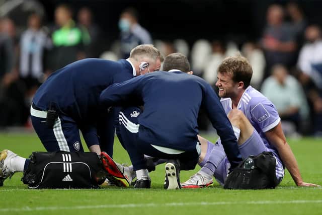 Leeds United striker Patrick Bamford receives treatment for an injury. Pic: Ian MacNicol.
