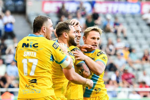 Richie Myler of Leeds Rhinos celebrates with team-mates after scoring a try against Castleford Tigers Picture by Will Palmer/SWpix.com
