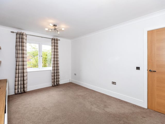 To the first floor is a spacious landing and an upstairs living room that could be used as a fourth double bedroom.