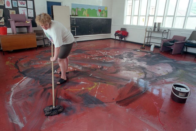 Assistant caretaker Sylvia Major cleans-up the vandalism at Middleton Primary School.