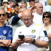 Leeds United fans donning the home and away shirts from the 2021/2022 season. Pic: Alex Davidson.