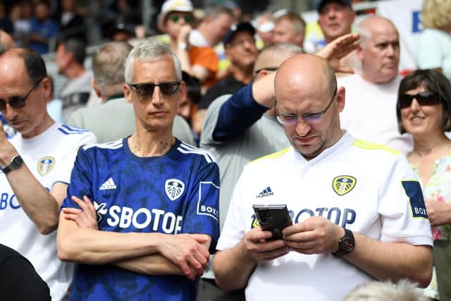 Leeds United fans donning the home and away shirts from the 2021/2022 season. Pic: Alex Davidson.