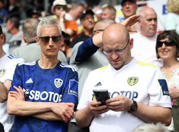 <p>Leeds United fans donning the home and away shirts from the 2021/2022 season. Pic: Alex Davidson.</p>