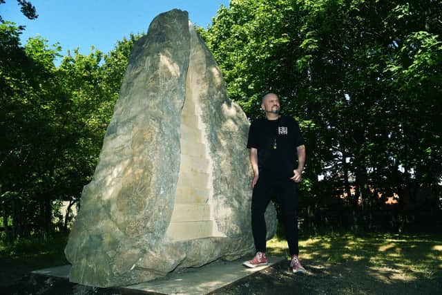 Bruce Davies, with the sculpture, off Tunstall Road.