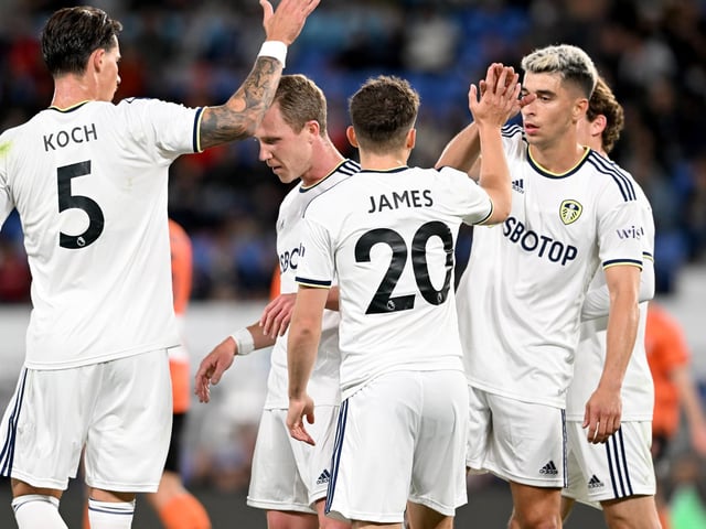 James is congratulated as Leeds celebrate going 1-0 up.
