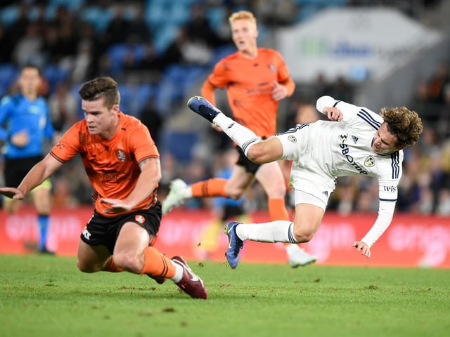 Leeds United's new USA international attacking midfielder Brenden Aaronson, right, battles it out with Connor Chapman.