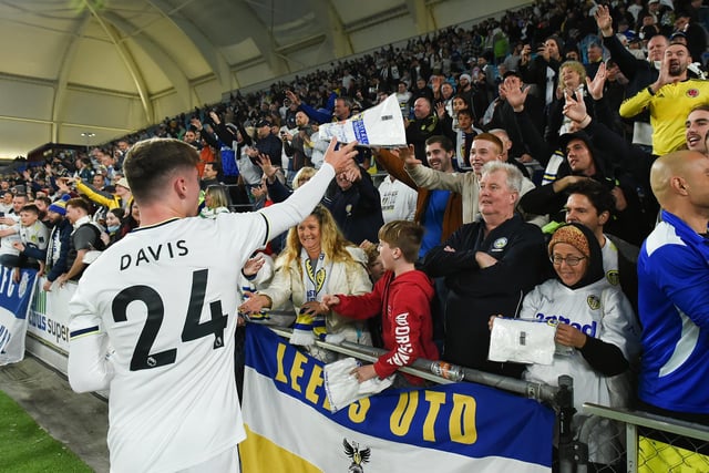 Young left back Leif Davis, on for the second half, heads to Leeds United's fans.