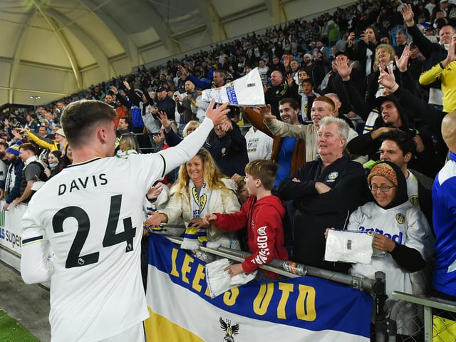 Young left back Leif Davis, on for the second half, heads to Leeds United's fans.