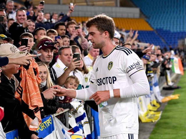 Whites no 9 Patrick Bamford heads to see the fans.