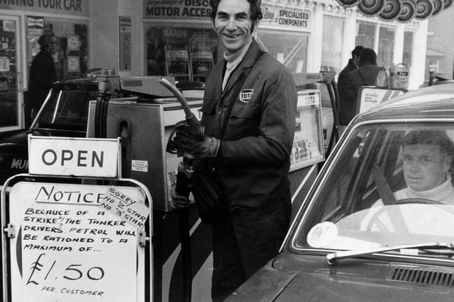Cyril Hoffman is pictured beside the pumps at a filling station in Harehills where customers were being rationed to a maximum of £1.50 worth of petrol in Britain's first oil price crisis in November 1973.