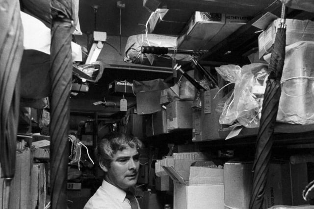 The Aladdin's Cave of the Post Office in JUly 1973.  Clarence Bateman is pictured among the racks and racks of lost property at Quebec Street.