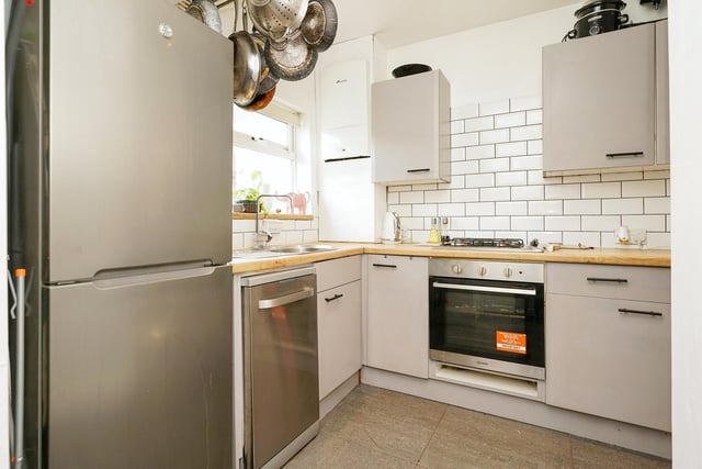 Fitted with a range of exquisite matching wall and base units, the kitchen offers a beautiful but functional space with white splash back tiles and a pantry storage cupboard, which also has plumbing for a washing machine.