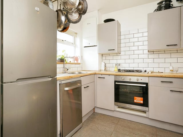 Fitted with a range of exquisite matching wall and base units, the kitchen offers a beautiful but functional space with white splash back tiles and a pantry storage cupboard, which also has plumbing for a washing machine.