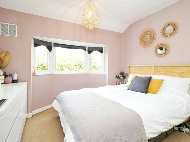 The first floor landing has doors leading to the three bedrooms and bathroom with access to the loft via hatch. The superbly decorated double bedroom has a window to the side elevation and space for wardrobes if desired.