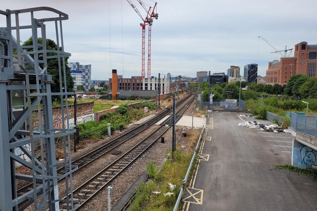 The station as seen from the Railway Street flyover. The former platform is to the left of the tracks where bushes are now growing. The car park on the right of the picture used to be home to a large warehouse, which burned down after the station was closed. (Pic: Richard Beecham)