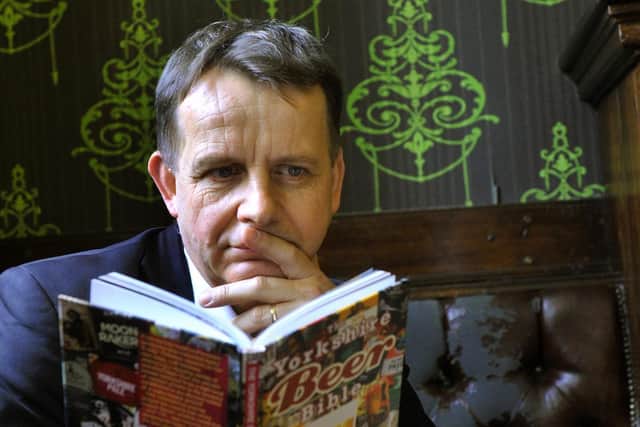 Pictured: Beer writer Simon Jenkins in The Fenton in Leeds with his book, The Yorkshire Beer Bible.