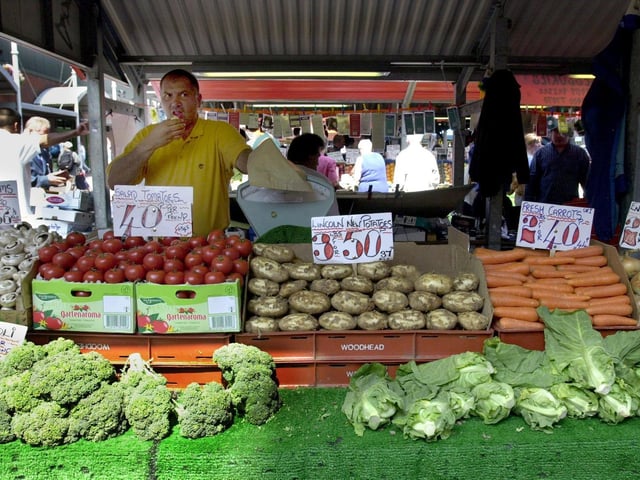 Fresh produce being sold in pounds as well as kilos on Kirkgate Market in Leeds.